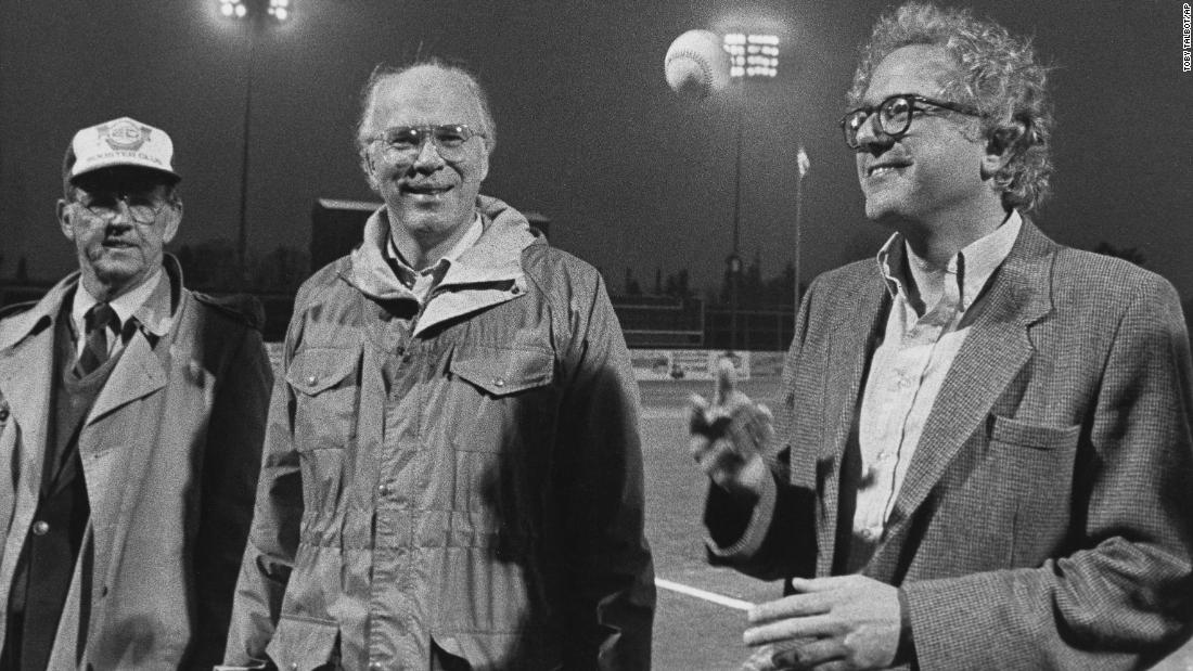 Sanders, right, tosses a baseball before a minor-league game in Vermont in 1984. US Sen. Patrick Leahy, center, was also on hand.